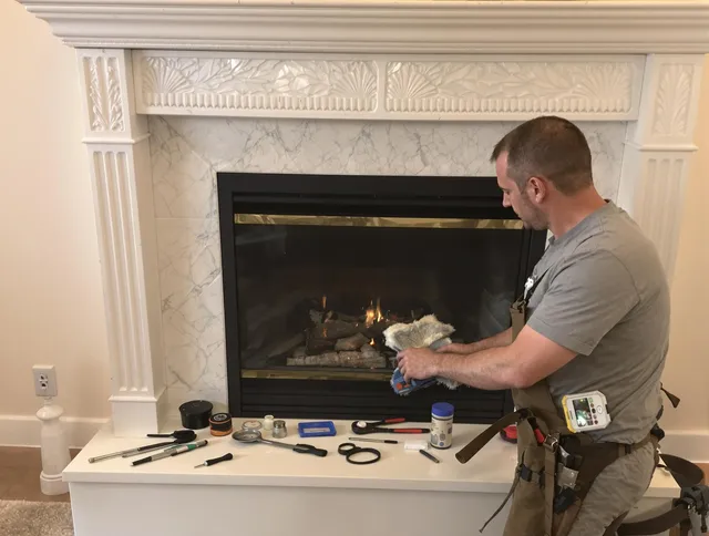 Barrington Chimney Sweep performing fireplace maintenance in Barrington, RI
